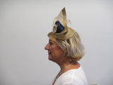 Upward curved fascinator with flower and feathers