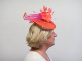 Saucer fascinator with feather flowers and crinoline