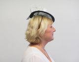 Small disc fascinator with ivory bows and ivory rose