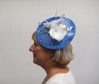 Disc fascinator with feather flowers and dalmonte netting