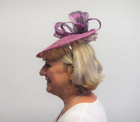 Upturned disc fascinator with ribbons and flowers