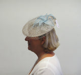 Disc fascinator with leaves, rose and netting