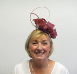 Bow fascinator with feather flowers and spine
