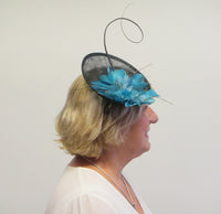Small saucer fascinator with flower and spine