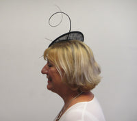 Small saucer fascinator with flower and spine