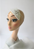 Ivory bridal headpiece with diamante and brooch