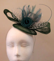 Bow and rose fascinator with lace netting and spine