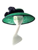 Beautiful emerald green hat with albaca band and bow with broach detail