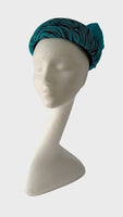 Turquoise zebra print pill box hat with silk abaca bow