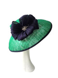 Beautiful emerald green hat with albaca band and bow with broach detail
