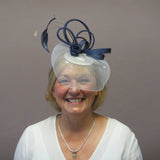 Crinoline fascinator with roses and feathers